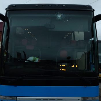 Yelloway M77YEL Coach in blue showing smashed windscreen